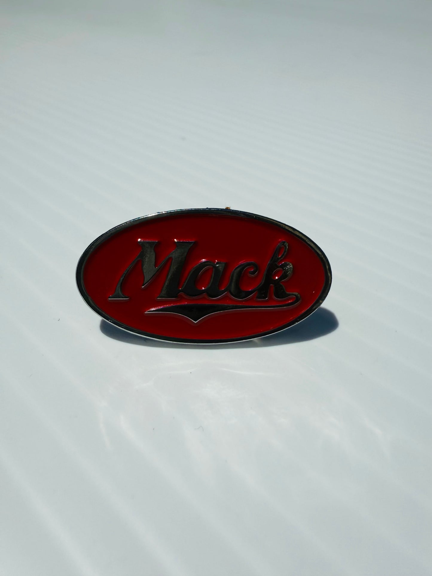 AACC - M5 - Mack red/silver oval Horn Honker Medallion
