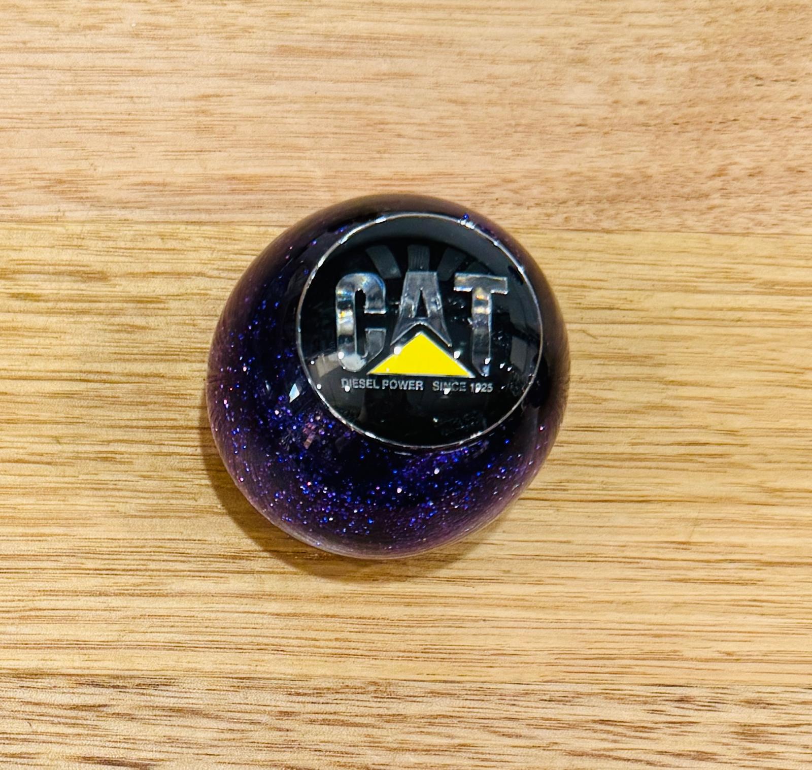 GS-CATP1 : Purple Glitter Round Gear Shifter Knob with Round black/silver/yellow CAT detail
