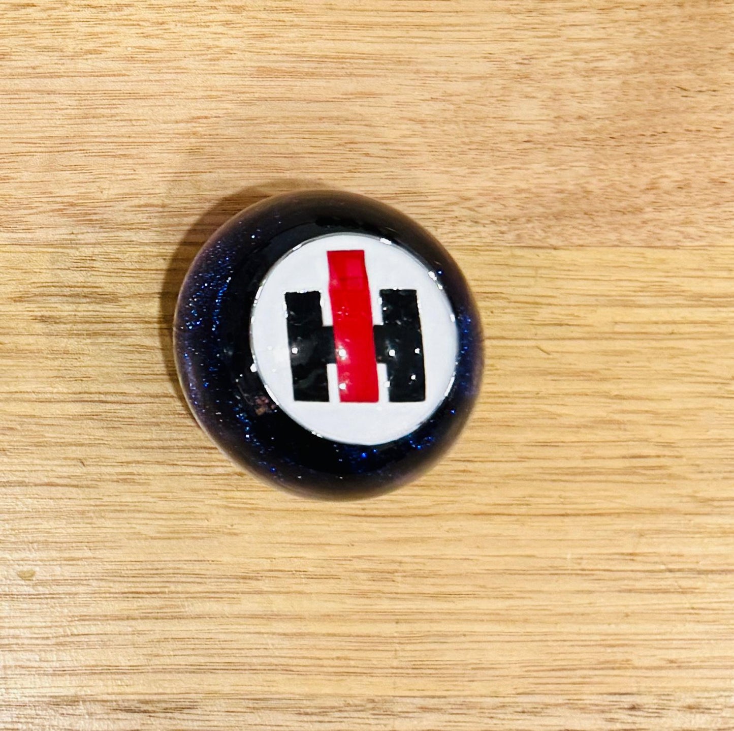 GS-IB2: Blue Glitter Round Gear Shifter Knob with Round white/red/black square INTERNATIONAL logo detail