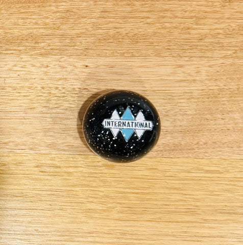 GS-IY2 : Black Glitter Round Knob with white/silver/blue INTERNATIONAL logo detail
