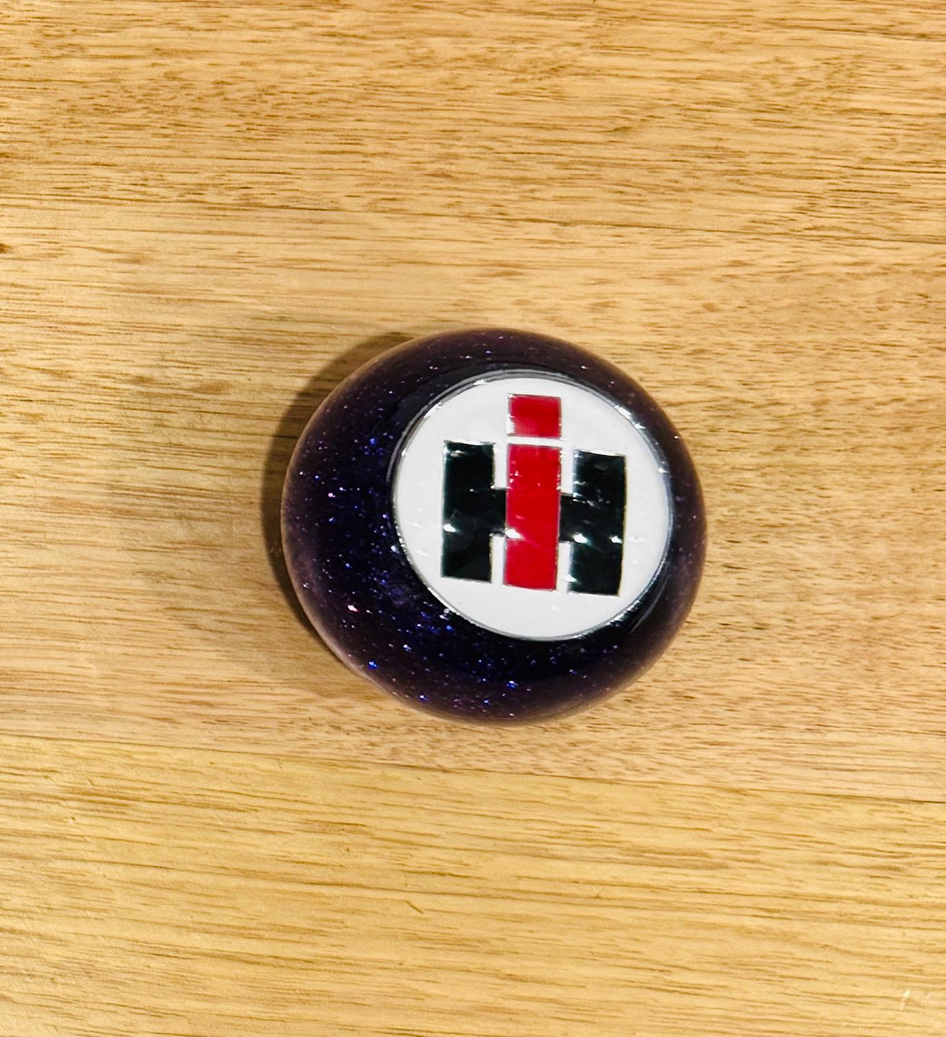 GS-IP2 : Purple Glitter Round Gear Shifter Knob with Round white/red/silver square INTERNATIONAL logo detail